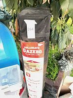 Full view of black carry bag with Collegiate Gazebo label