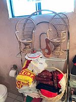 overall lot with wicker chairs, linens, basket, bird, doily