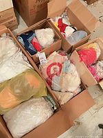 Boxes filled with packaged baby and kids clothing
