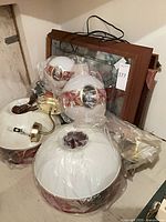 Group of globes, framed panels, wiring and hardware