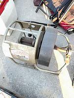 Full side view of Cobra sewer machine showing frame, motor housing and drive wheel