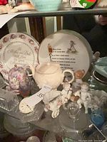 Group of plates, figurines, sugar bowl, milk glass vases and blue cup
