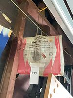 Front view of packaged Cook-Out grill basket hanging