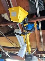 Front view of yellow flood light on tripod