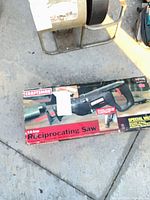 Full view of Craftsman reciprocating saw box on ground