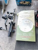 Boxed Franklin Brass seat beside folded pedal exerciser