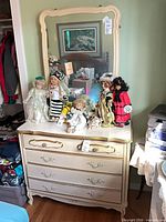 Front view of dresser with four drawers and attached mirror