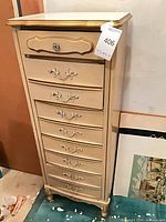 Full front and side view of cream French Provincial lingerie chest showing overall design and seven visible drawers