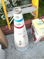 Megaphone standing upright showing graphics and stripes