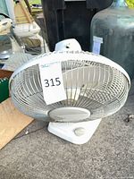 Front angled view of Lasko table fan showing overall design and grille