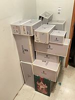 Overall view of stacked Lladró boxes showing quantity and official branding