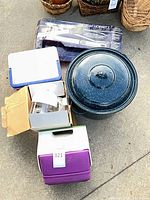 Group showing roasting pot, boxed chopper, Hoffritz tongs box, two coolers