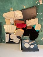 Group of small bags stacked showing colors and styles