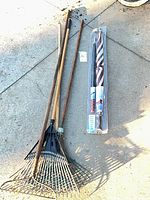 All three rakes and packaged flag kit laid out on concrete