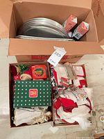 overall view of two boxes with bakeware and decorations