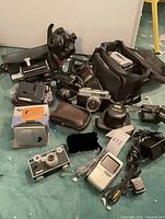 Group shot of all cameras, camcorder, bag and accessories