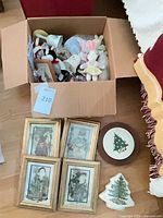 Entire lot showing box of small items, framed prints, tree plate, round tile