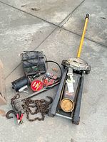 Group shot of jack, charger, motor, wax, chain, clamps and accessories