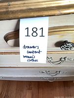Drawer tag and dresser front indicating lot