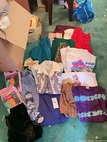 Overview of all assorted garments spread on floor