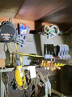 Wide view showing trouble light, screwdrivers, clamps, hardware