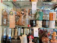 Overview of shelf showing Chihuahua figurine, stackable mugs, beer stein, shot glasses