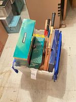 Lot overview showing tote filled with racquets and boxed CD pack