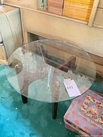 Full view of round glass-top side table