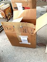 Closed cardboard box with lot label