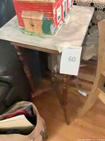 Full view of side table beside furniture