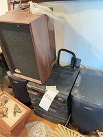 Overall view showing Laserline speaker atop Sony component stack with Sony speaker cabinets