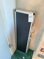 Closed aluminum case upright with tag attached