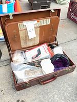 Open vintage briefcase showing all contents together