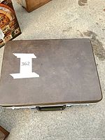 Closed brown suitcase, exterior view