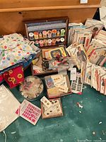 Group view of patterns, thread box, scissors, buttons