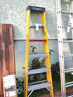 Full view of Werner yellow fiberglass step ladder