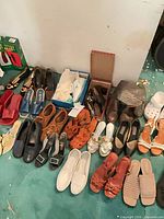 Overview showing most shoes laid out in two rows