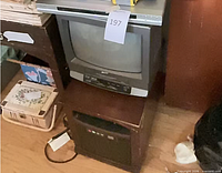 Full view of Zenith CRT TV/VCR on stand with Sony DVD player on top