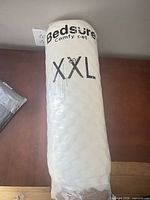 Front view of vacuum-sealed Bedsure XXL pet bed