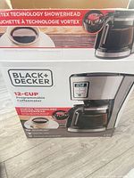 Retail box showing Black+Decker 12-cup programmable coffeemaker imagery and specifications