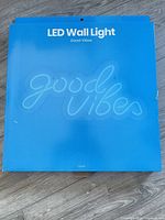 Front of retail box showing product name and faint outline of sign