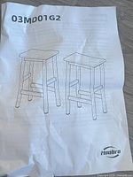 Instruction sheet showing line drawing of two stools and model 03MD01G2