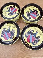 Top view of all four tins showing brand and product line