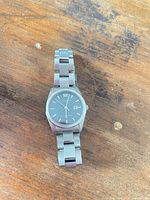 Front view of watch showing dial, bracelet and overall design