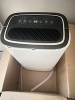 Top view of dehumidifier control panel and grille