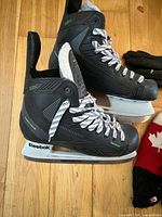 Side view of Reebok 22K skates showing boot, blade holder and laces