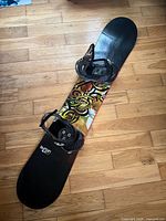 Full view of Burton Air 57 snowboard with bindings attached