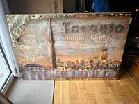 Front view of mixed-media Toronto skyline wall art showing design and text