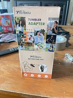 Front of both boxed Trandiou tumbler adapters