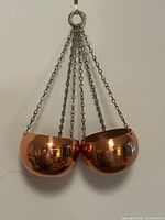 Front view of both copper planters hanging from chains